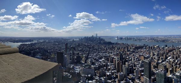 High angle view of city buildings against sky