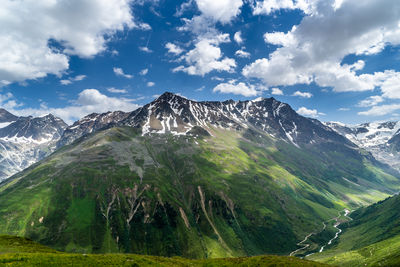 Scenic view of snowcapped mountains against sky