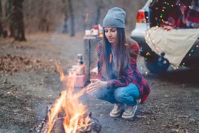 People sitting on bonfire