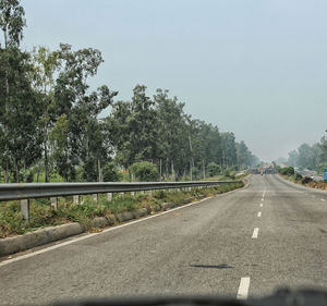 Road seen through car windshield