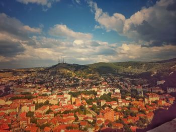 Aerial view of townscape against sky