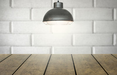 Close-up of illuminated lamp on wall