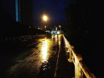 Wet illuminated city at night