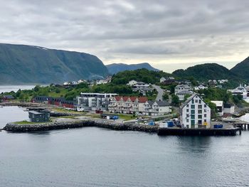 Panoramic view of townscape by sea against sky