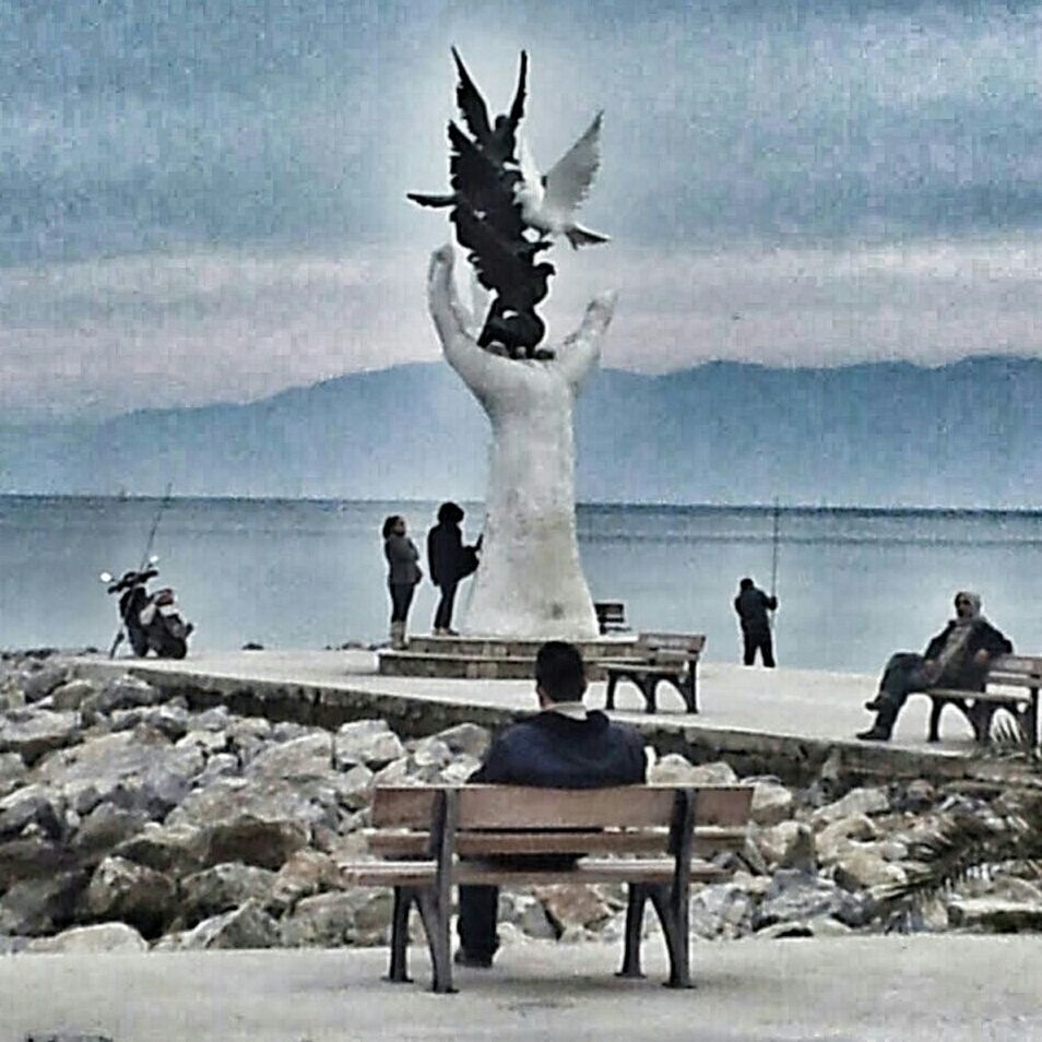 water, sky, sea, men, bench, mountain, cloud - sky, tranquility, person, sitting, lifestyles, statue, nature, tranquil scene, scenics, tourism, leisure activity, cloud, travel destinations