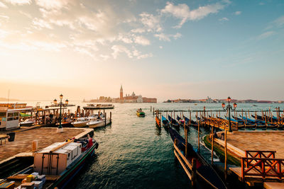 Boats moored at harbor