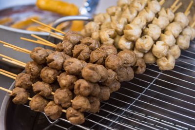 High angle view of meat on barbecue