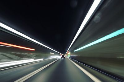 Light trails on road in tunnel