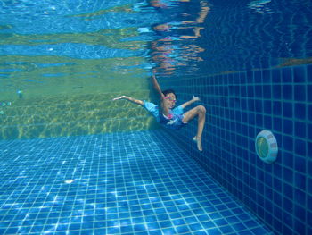 High angle view of man swimming in pool