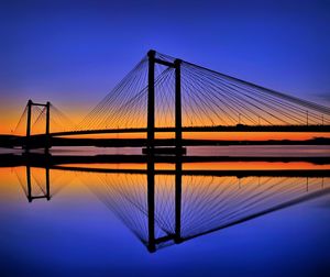 Amazing reflection of cable bridge at sunset over the columbia river, tri-cities washington