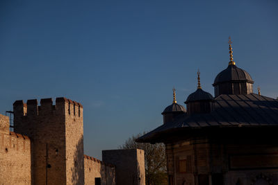 Low angle view of building against blue sky