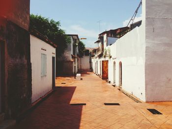 Narrow alley along buildings