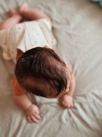 Boy sleeping on bed