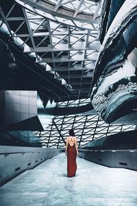 Rear view of woman with umbrella