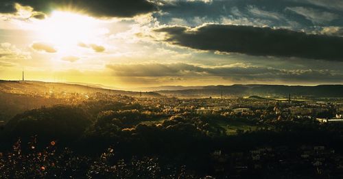 Aerial view of cityscape against sky during sunset