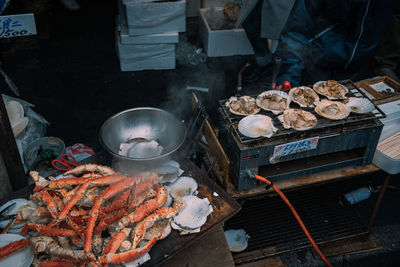  preparing seafood on barbecue grill
