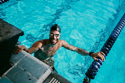 Happy male swimmer in swimming pool