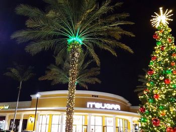 Low angle view of illuminated building at night