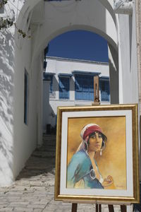 Portrait of woman against building