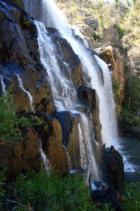 Scenic view of stream flowing through rocks