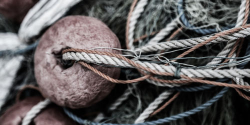 Close-up of old buoy and fishing net