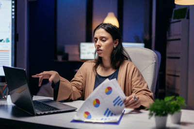 Tired businesswoman working in office