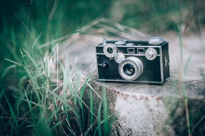 Close-up of camera on field