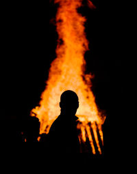 View of bonfire at night