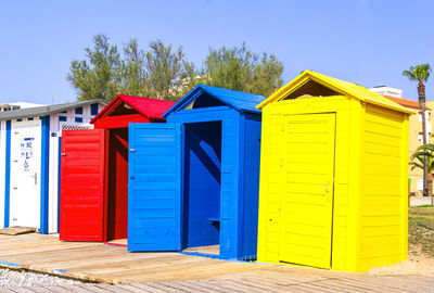 Multicolored wooden booths for public restrooms