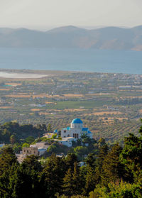 High angle view of buildings and mountains against sky