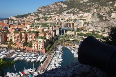 High angle view of buildings by sea