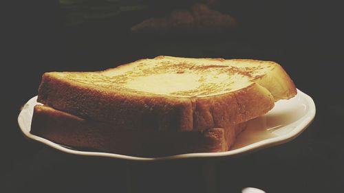 Close-up of cake against black background