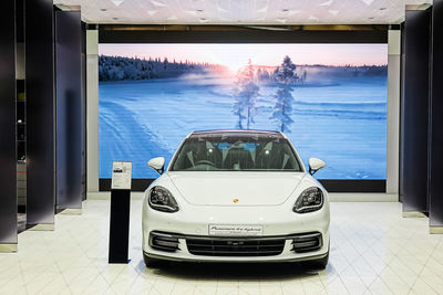 Digital composite image of car on illuminated glass