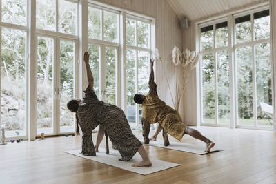 Man and woman doing yoga