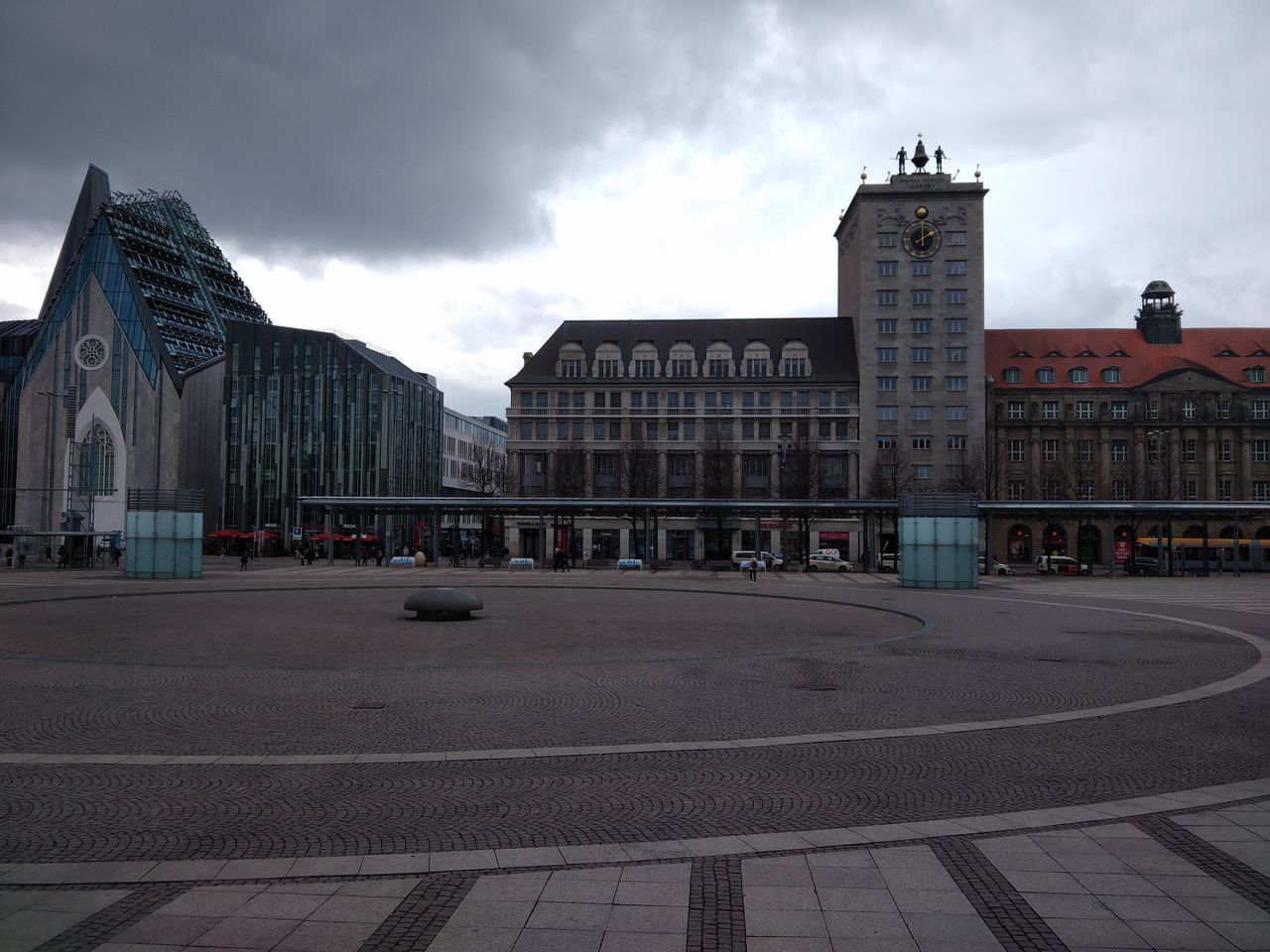 BUILDINGS AGAINST CLOUDY SKY