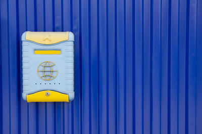 Full frame shot of closed metal on blue wall