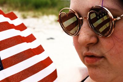 Close-up portrait of man wearing sunglasses