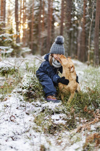 Man with dog in snow