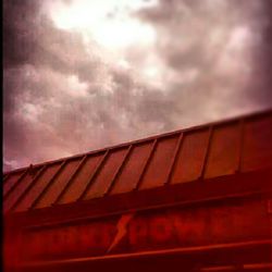 Low angle view of built structure against cloudy sky