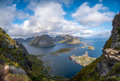 Panoramic view of sea and mountains against sky