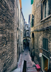 Narrow alley along buildings