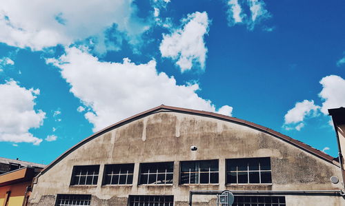 Low angle view of building against blue sky