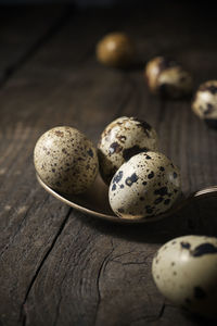 Quail eggs on a wooden table.