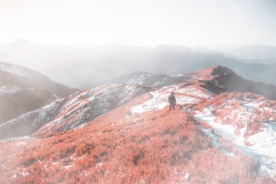 Scenic view of mountains against sky during winter