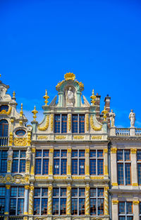 Low angle view of building against blue sky