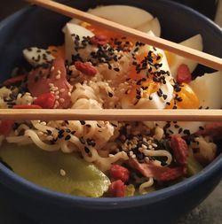 High angle view of chopped fruits in bowl on table