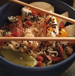 High angle view of chopped fruits in bowl on table