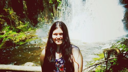 Portrait of smiling young woman in water