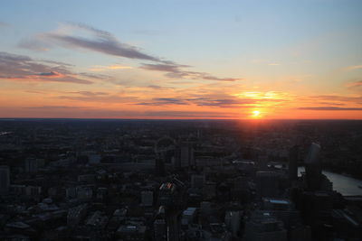 High angle view of buildings against sky during sunset