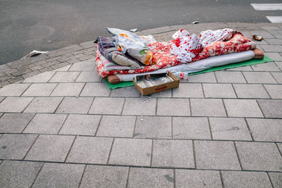 High angle view of garbage on sidewalk